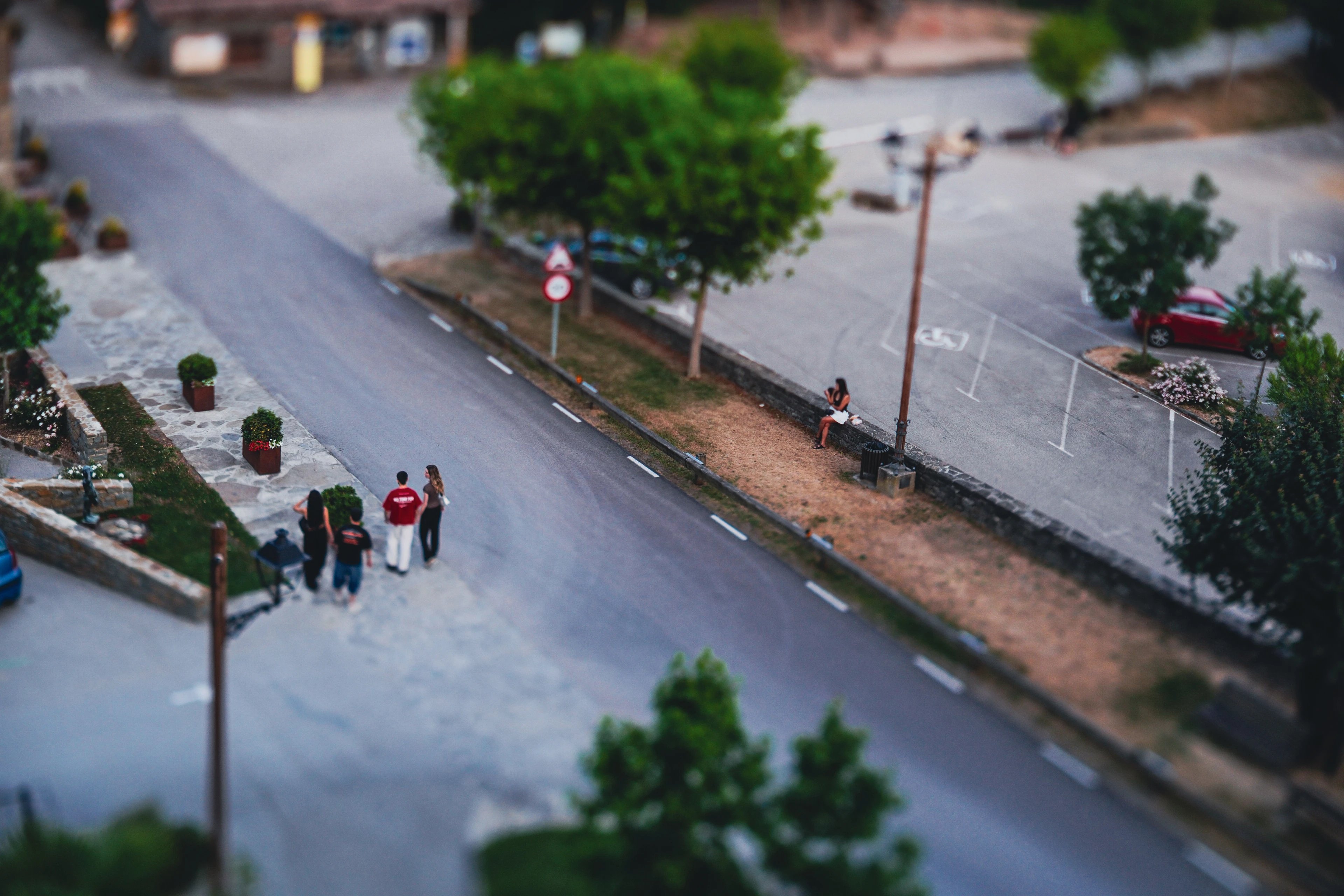 Pedestrians on a road seen from above with selective focus
